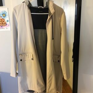 Cream colored raincoat jacket
